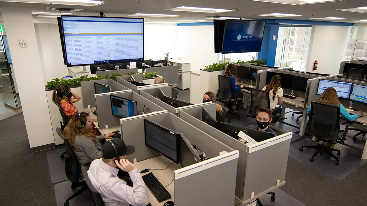 Operators watching live video in a monitoring room